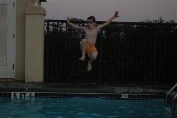Steven jumping into the pool