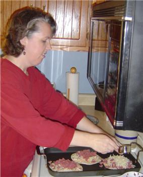 Karen prepares the quesadillas
